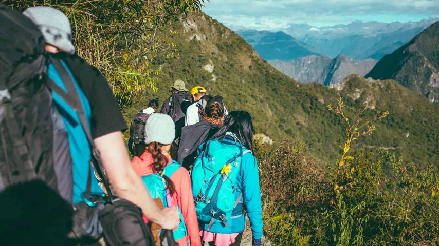 Members of a hiking party on the trail